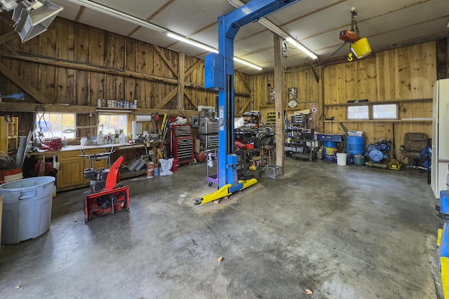 259 Mountain St, Camden, ME 04843 - garage with a workshop area and wood walls
