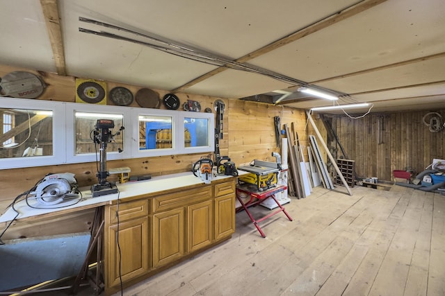 259 Mountain St, Camden, ME 04843 - kitchen featuring wooden walls, light wood-style flooring, brown cabinetry, and light countertops