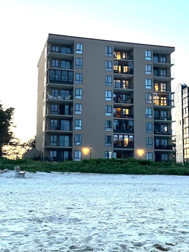 205 E Grand Ave Unit 7D, Old Orchard Beach, ME 04064 - property at dusk with a water view and a view of apartment building / complex