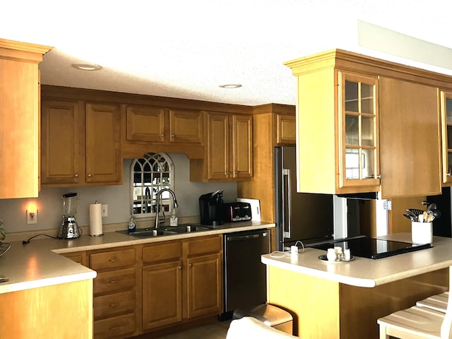 205 E Grand Ave Unit 7D, Old Orchard Beach, ME 04064 - kitchen with dishwashing machine, a kitchen bar, brown cabinetry, glass insert cabinets, and light countertops