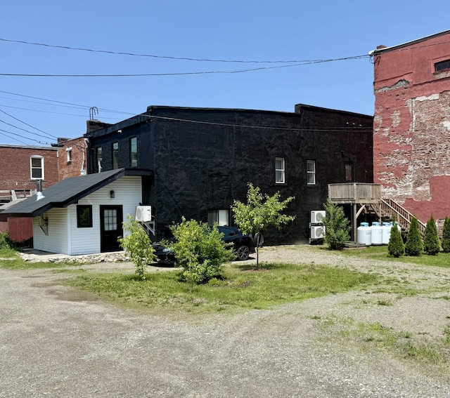 339 Main St, Calais, ME 04619 - view of side of property with stairs