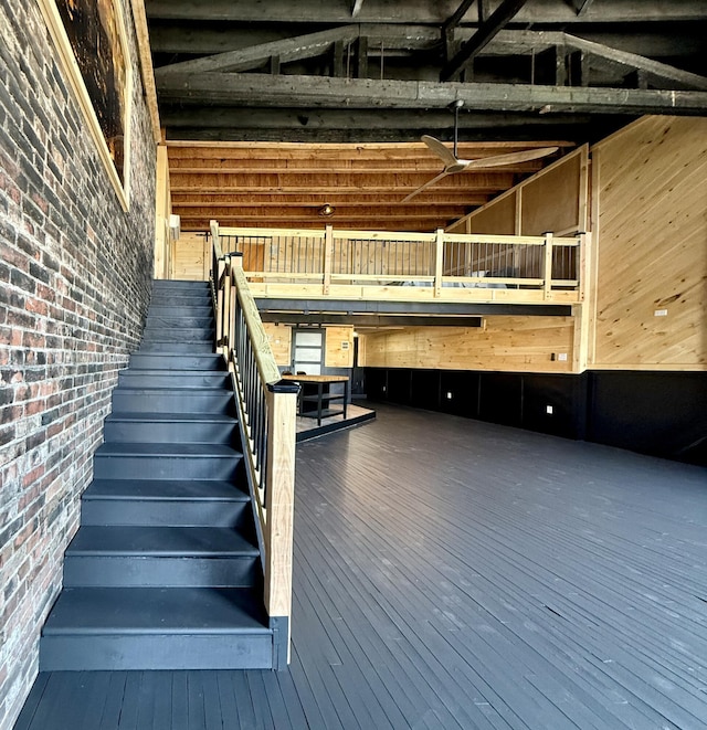 339 Main St, Calais, ME 04619 - stairs with wood-type flooring and brick wall