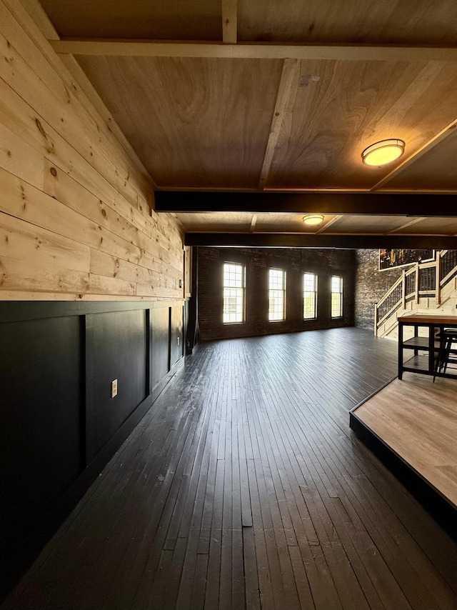 339 Main St, Calais, ME 04619 - additional living space with dark wood-style floors, wood ceiling, wood walls, and stairway