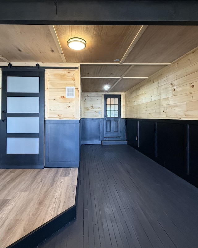 339 Main St, Calais, ME 04619 - spare room featuring hardwood / wood-style floors and wooden walls