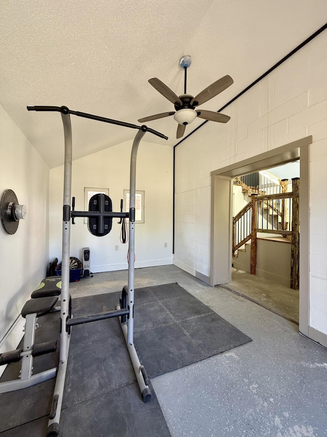 339 Main St, Calais, ME 04619 - workout room with ceiling fan, concrete block wall, vaulted ceiling, and a textured ceiling
