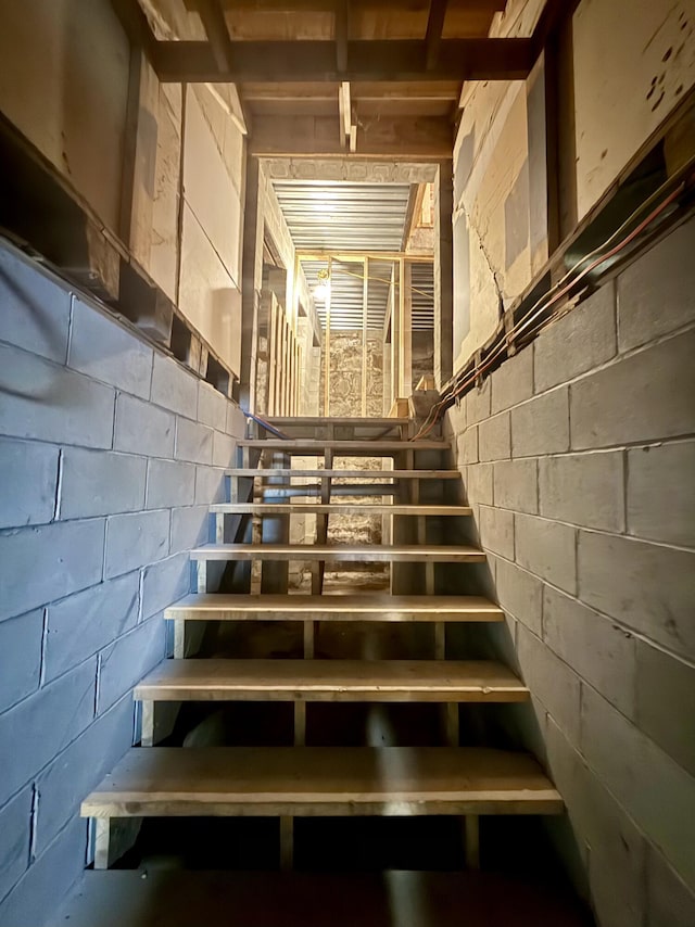 339 Main St, Calais, ME 04619 - stairway featuring concrete block wall