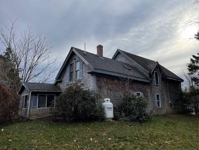1069 Rte 193, Deblois, ME 04622 - view of side of home featuring a chimney and a yard