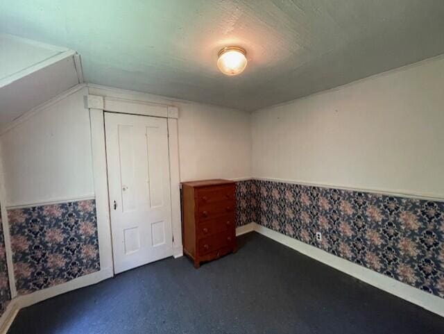 1069 Rte 193, Deblois, ME 04622 - unfurnished bedroom featuring dark colored carpet and a closet