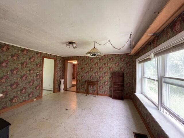 1069 Rte 193, Deblois, ME 04622 - empty room with tile patterned floors and wallpapered walls