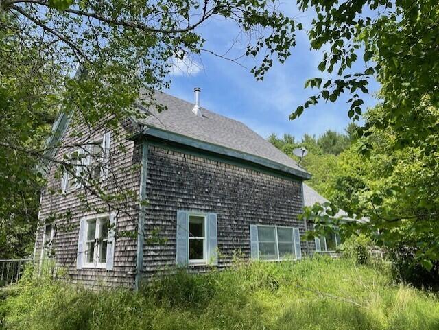 1069 Rte 193, Deblois, ME 04622 - view of side of property featuring a shingled roof