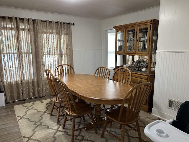 40 Silvermount St, Waterville, ME 04901 - dining area featuring ornamental molding, light wood-style floors, and wainscoting