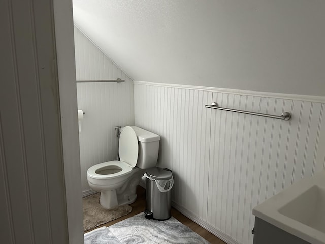 40 Silvermount St, Waterville, ME 04901 - bathroom featuring lofted ceiling and wood finished floors