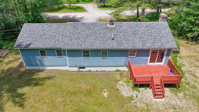 68 Hannibal Cir, Denmark, ME 04022 - back of house with a shingled roof, a deck, a chimney, and a lawn