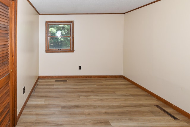 68 Hannibal Cir, Denmark, ME 04022 - spare room featuring crown molding and light wood finished floors