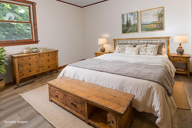 68 Hannibal Cir, Denmark, ME 04022 - bedroom with light wood-type flooring and crown molding
