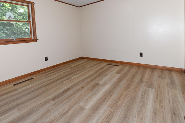68 Hannibal Cir, Denmark, ME 04022 - spare room featuring ornamental molding and light wood-style floors