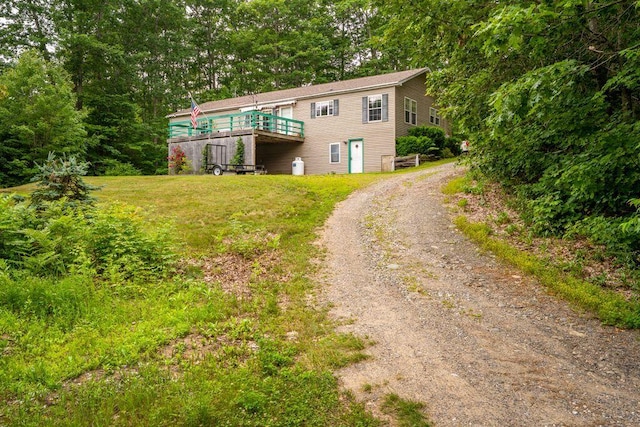 1080 Old Augusta Rd, Waldoboro, ME 04572 - view of front of house featuring driveway, a wooden deck, and a front lawn