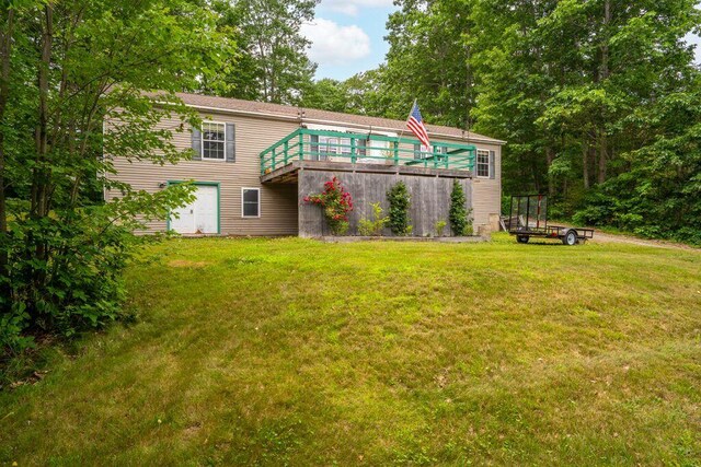 1080 Old Augusta Rd, Waldoboro, ME 04572 - back of property with a wooden deck and a lawn