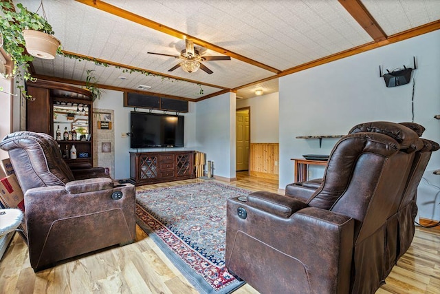 1080 Old Augusta Rd, Waldoboro, ME 04572 - living area with crown molding, wood finished floors, ceiling fan, and wainscoting
