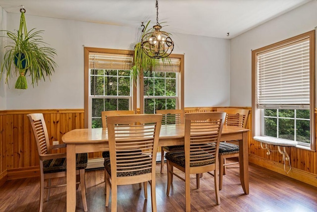 1080 Old Augusta Rd, Waldoboro, ME 04572 - dining area with wood finished floors, a chandelier, wood walls, and wainscoting