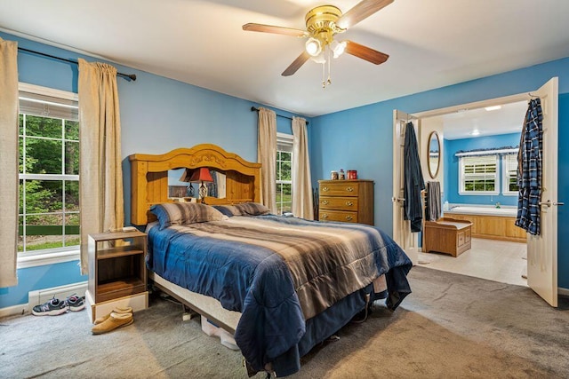 1080 Old Augusta Rd, Waldoboro, ME 04572 - bedroom with light colored carpet, multiple windows, and a ceiling fan