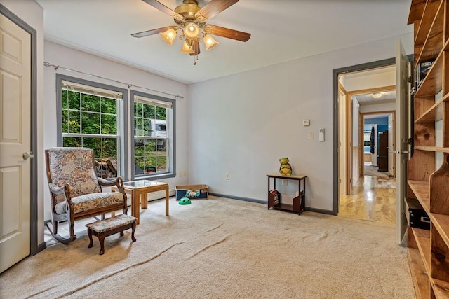 1080 Old Augusta Rd, Waldoboro, ME 04572 - living area featuring light colored carpet and ceiling fan