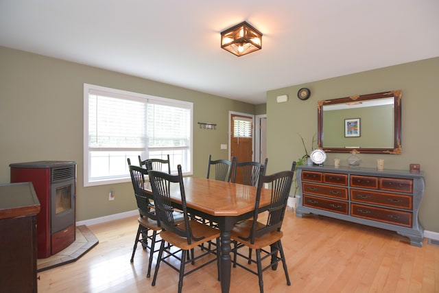 3 Erins Way S, Berwick, ME 03908 - dining area featuring healthy amount of natural light, light wood finished floors, and a wood stove