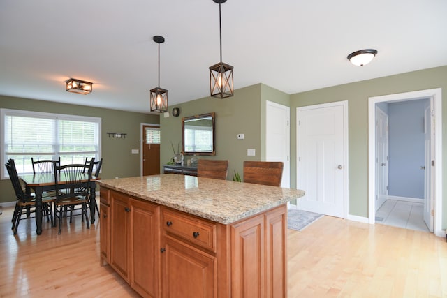 3 Erins Way S, Berwick, ME 03908 - kitchen with light wood-style flooring, plenty of natural light, hanging light fixtures, and a center island
