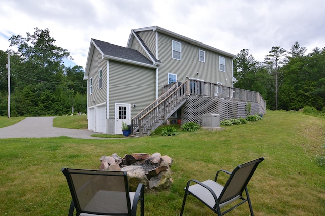 3 Erins Way S, Berwick, ME 03908 - back of property featuring stairway, a garage, a yard, a deck, and concrete driveway