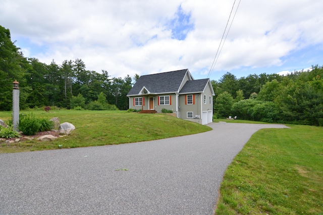 3 Erins Way S, Berwick, ME 03908 - view of front facade with asphalt driveway, a garage, and a front yard