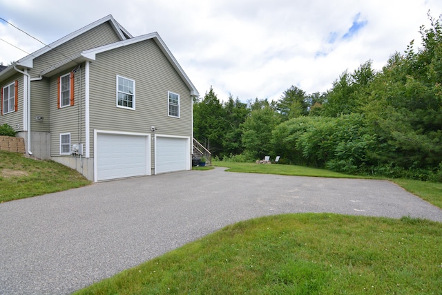 3 Erins Way S, Berwick, ME 03908 - view of side of home featuring asphalt driveway, an attached garage, and a lawn