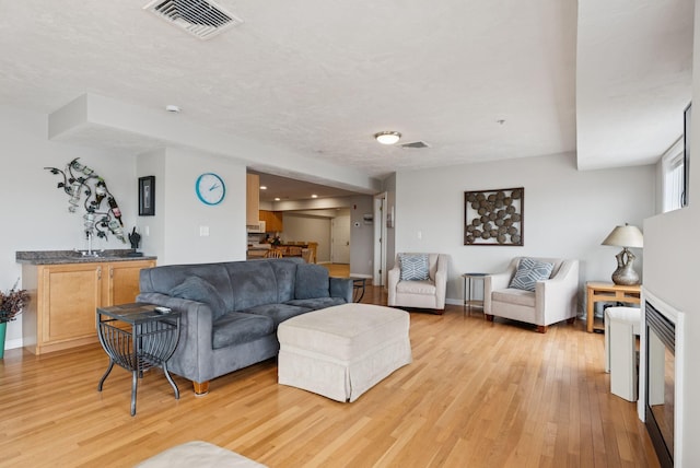 170 E Grand Ave Unit 8, Old Orchard Beach, ME 04064 - living room with light wood-style flooring and wet bar