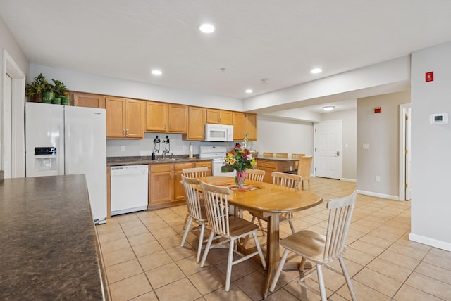 170 E Grand Ave Unit 8, Old Orchard Beach, ME 04064 - kitchen with white appliances, light tile patterned floors, dark countertops, and recessed lighting