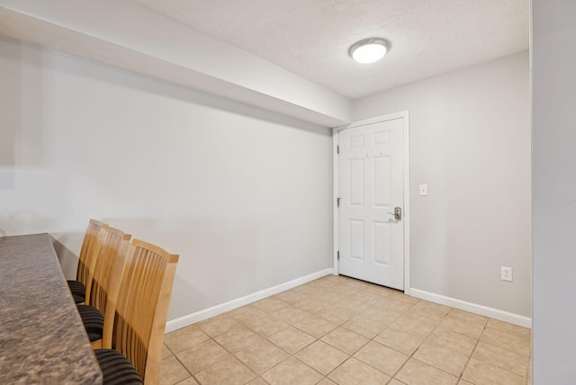 170 E Grand Ave Unit 8, Old Orchard Beach, ME 04064 - spare room featuring baseboards and light tile patterned floors