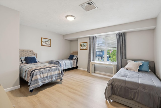 170 E Grand Ave Unit 8, Old Orchard Beach, ME 04064 - bedroom with light wood-style flooring and baseboards