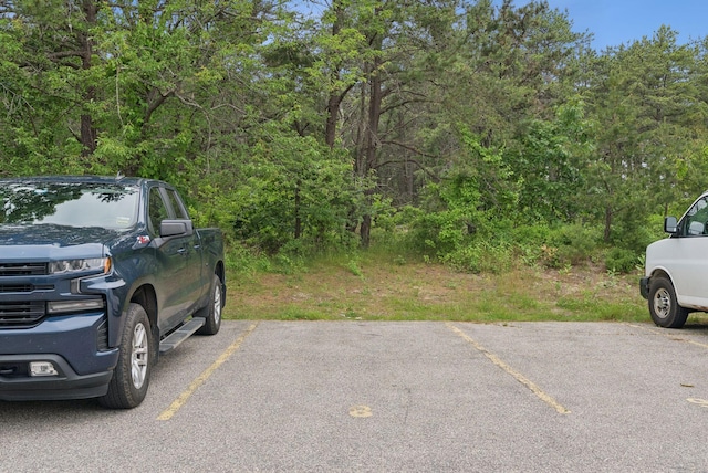 170 E Grand Ave Unit 8, Old Orchard Beach, ME 04064 - uncovered parking lot with a view of trees