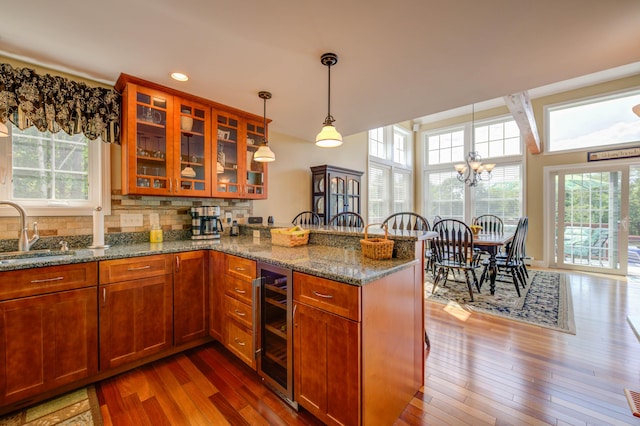 11 Washington Ct, Naples, ME 04055 - kitchen featuring wine cooler, plenty of natural light, a peninsula, stone countertops, and recessed lighting