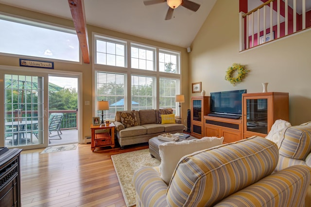 11 Washington Ct, Naples, ME 04055 - living area with high vaulted ceiling, ceiling fan, light wood-type flooring, and baseboard heating