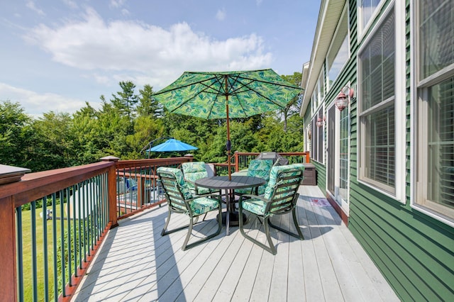 11 Washington Ct, Naples, ME 04055 - wooden deck with outdoor dining space