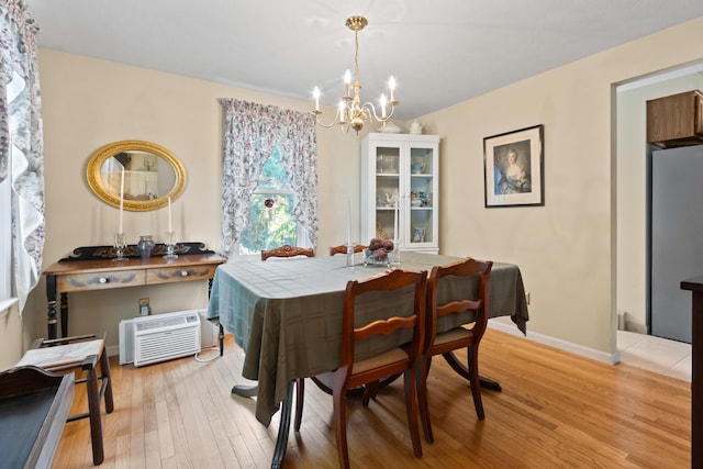 23 Laurel Pines Dr, Gorham, ME 04038 - dining area featuring a chandelier, light wood-style flooring, and an AC wall unit