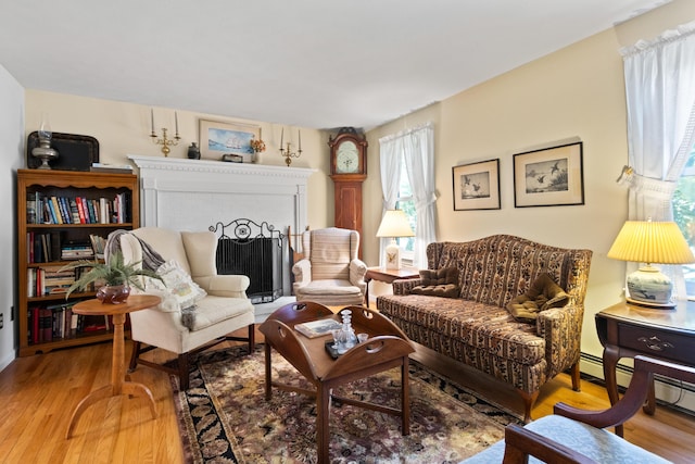 23 Laurel Pines Dr, Gorham, ME 04038 - living area with light wood finished floors and a fireplace