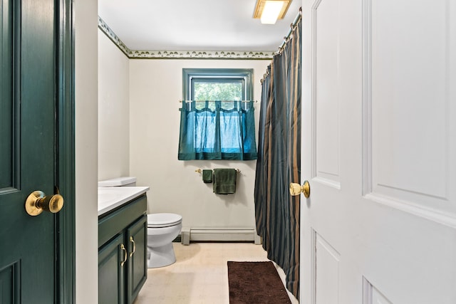 23 Laurel Pines Dr, Gorham, ME 04038 - bathroom featuring a baseboard heating unit, vanity, and tile patterned floors