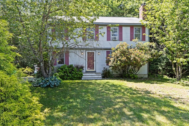 23 Laurel Pines Dr, Gorham, ME 04038 - colonial home with a front yard and a chimney