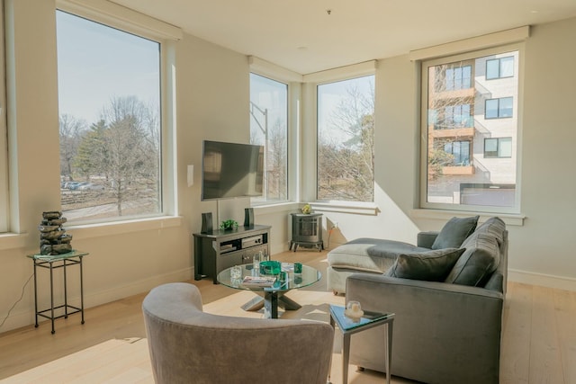 167 Newbury St Unit 206, Portland, ME 04101 - living room with wood finished floors and plenty of natural light