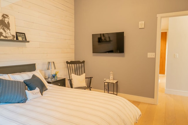 167 Newbury St Unit 206, Portland, ME 04101 - bedroom with wood finished floors and wooden walls