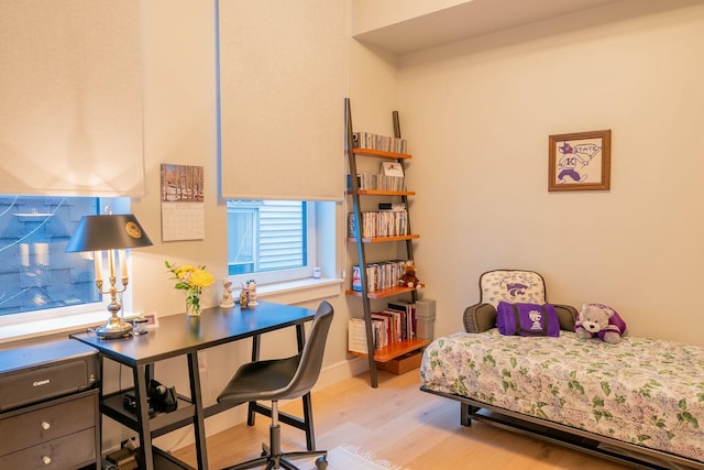 167 Newbury St Unit 206, Portland, ME 04101 - bedroom with light wood-style floors and an office area