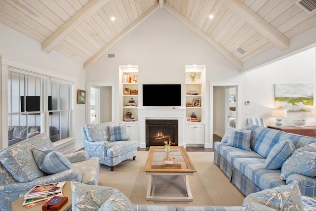 126 Mile Stretch Rd, Biddeford, ME 04005 - living room featuring high vaulted ceiling, a wood ceiling with exposed beams, a warm lit fireplace, and built in features