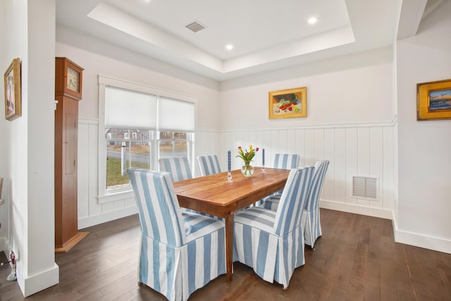 126 Mile Stretch Rd, Biddeford, ME 04005 - dining space featuring a tray ceiling, dark wood finished floors, a wainscoted wall, and recessed lighting