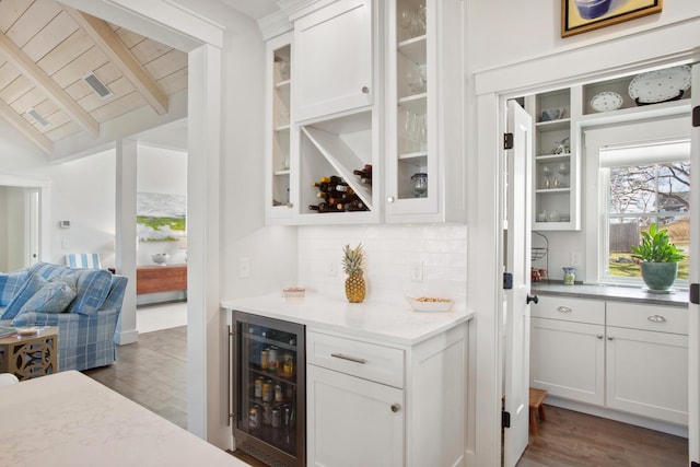 126 Mile Stretch Rd, Biddeford, ME 04005 - indoor dry bar featuring beverage cooler, decorative backsplash, wood finished floors, and wooden ceiling