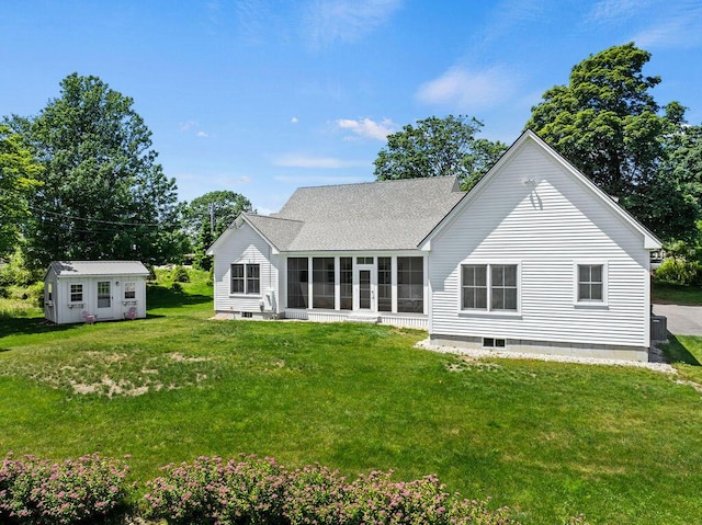 126 Mile Stretch Rd, Biddeford, ME 04005 - back of house featuring a sunroom, a yard, roof with shingles, and a storage shed
